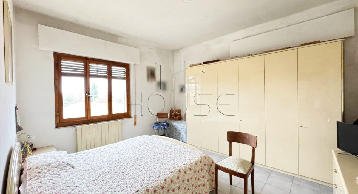Appartamento con terrazza, garage e giardino comune